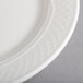 A close-up of a Homer Laughlin Kensington Ameriwhite bright white china plate with a pattern.