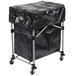 A black Rubbermaid cover on a black cart with wheels.