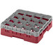A red and grey plastic Cambro glass rack with sixteen compartments.