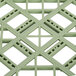 A close-up of a green plastic grid with squares.