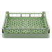 A light green plastic Vollrath dish rack with four compartments.