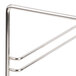 A metal rack with four triangle-shaped shelves and three parallel bars.