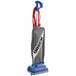 An Oreck XL2100RHS lightweight upright bagged vacuum cleaner with a blue and grey bag and blue handle.