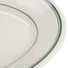 A white oval platter with green trim on the edge.