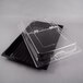 A black polycarbonate tray with clear hinged cover with two compartments.
