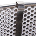 A metal mesh bowl stabilizer with metal clips for Paragon cotton candy machines.