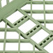 A light green plastic Vollrath dish rack with several squares.