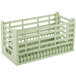 A light green plastic crate with metal bars and four compartments.