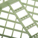 A close-up of a green plastic grid.