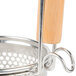 A Thunder Group stainless steel strainer/blanching basket with a wooden handle.