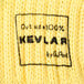 A close up of yellow Kevlar knitted fabric.