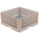A beige plastic Vollrath Plate Crate with metal grates.
