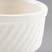 An ivory Hall China souffle dish with a swirl design.