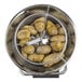 A metal bowl of potatoes in a Hobart bulk food processor.
