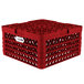 A red plastic Vollrath Traex Plate Crate with compartments and holes.