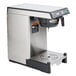 A silver and black Bunn SmartWAVE coffee and tea brewer on a stainless steel base.