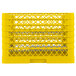 A yellow plastic Vollrath Traex plate rack with 20 compartments.