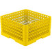 A yellow plastic Vollrath Traex plate rack with metal wire grates.