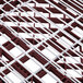 A close-up of a red and white metal grid with 44 compartments.