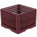 A burgundy plastic Vollrath plate rack with metal grate.
