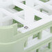 A white and green plastic Vollrath screw for glass racks.