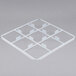 A white plastic Vollrath trim divider with 9 compartments.