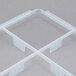 A white plastic Vollrath glass rack trim divider with 9 compartments.