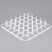 A white plastic grid with many square holes.
