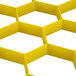 A yellow plastic grid extender for Vollrath glass racks with hexagons.