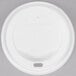 A white Solo plastic dome lid with text and a sip hole.