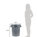 A woman standing next to a Continental grey round trash can.