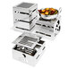 A stainless steel Eastern Tabletop buffet shelf holding metal containers of food on a table.