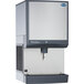 A large stainless steel rectangular Follett countertop ice maker and dispenser.