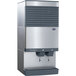A Follett stainless steel countertop ice machine with two water dispensers.