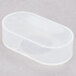 A white plastic oval-shaped switch cover.