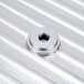 A close-up of a silver metal circular blade cover with a hole.
