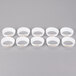 A group of white plastic rings with gold text reading "Salad Dressing"