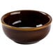 A brown Tuxton China sauce dish with a brown rim.