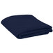 A folded navy blue table cover on a white surface.