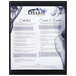A black Menu Solutions K22-Kent menu board on a counter.