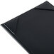 A black rectangular Menu Solutions menu board with corner corners on a table.