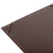 A close-up of a brown rectangular Menu Solutions board.