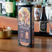 A Menu Solutions triple panel table tent with a picture of beer on a table.