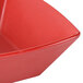 A close up of a matte red GET Matteware boat bowl with a small hole in the middle.