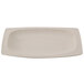 A matte sandstone oval platter with a speckled surface.
