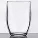 A clear GET SAN plastic stemless wine glass on a table.