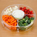 A Polar Pak clear plastic catering tray with 5 compartments filled with baby carrots, broccoli, and dip.