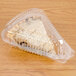 A piece of pie in a Polar Pak clear plastic container with a low dome lid.