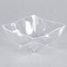 A clear plastic bowl with a wavy edge.