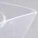 A clear plastic bowl with a curved edge.